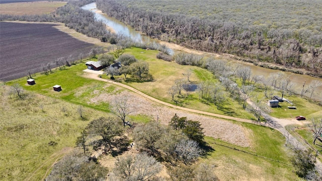 birds eye view of property featuring a rural view and a water view