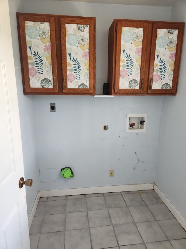 laundry room with cabinet space, electric dryer hookup, baseboards, and washer hookup