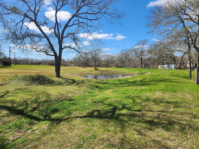 view of yard with a water view