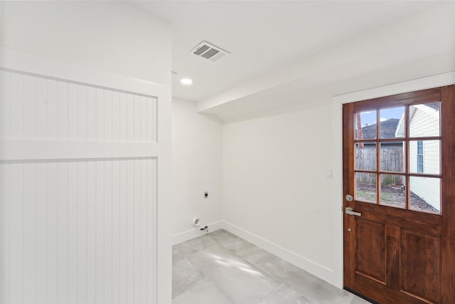 laundry area featuring visible vents, electric dryer hookup, laundry area, and baseboards