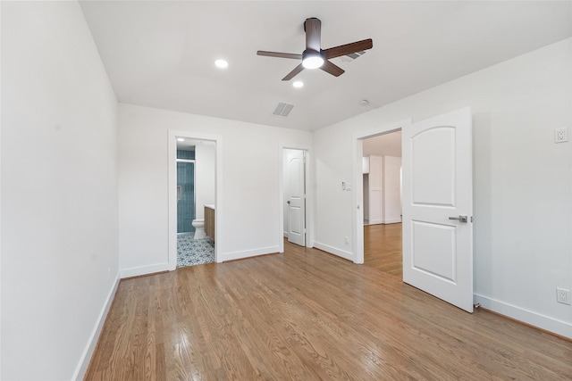 unfurnished bedroom featuring visible vents, connected bathroom, baseboards, light wood-type flooring, and recessed lighting