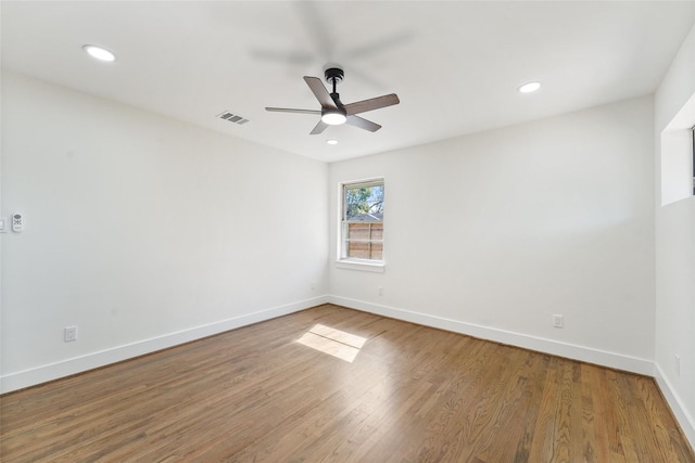 unfurnished room featuring visible vents, baseboards, ceiling fan, recessed lighting, and wood finished floors