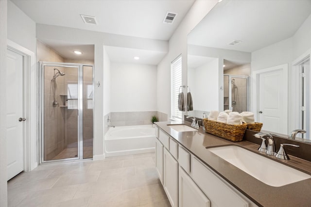 full bathroom featuring a bath, visible vents, a shower stall, and a sink