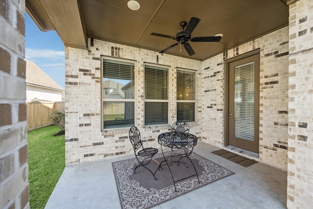 view of patio / terrace featuring a ceiling fan and fence