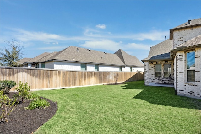 view of yard featuring a patio and a fenced backyard