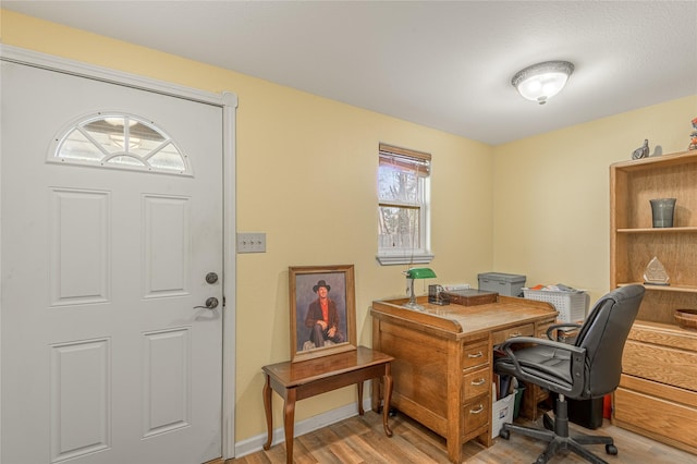 home office featuring light wood-style floors and baseboards