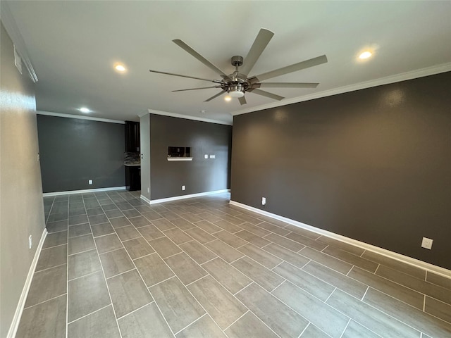 unfurnished room with baseboards, a ceiling fan, and ornamental molding