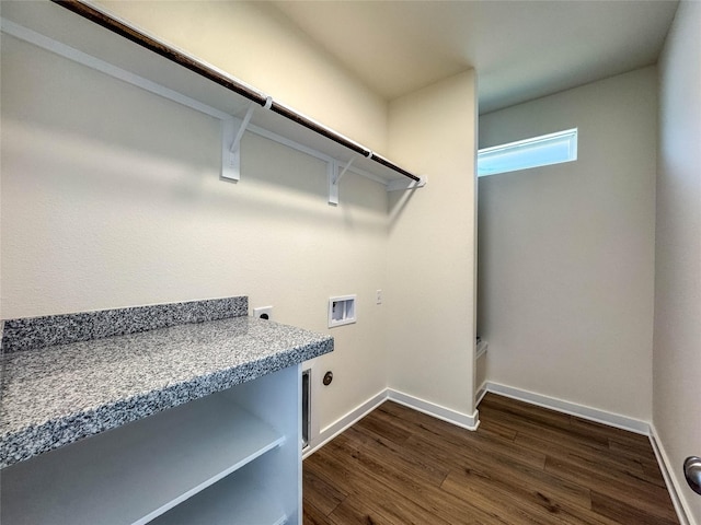 clothes washing area with baseboards, dark wood finished floors, washer hookup, laundry area, and electric dryer hookup