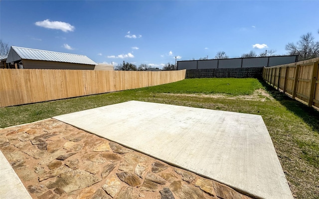 view of yard featuring a fenced backyard and a patio area