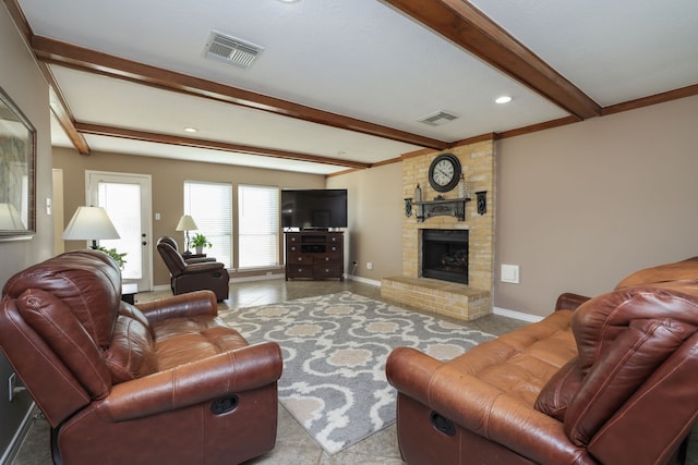 living room with visible vents, baseboards, and a fireplace