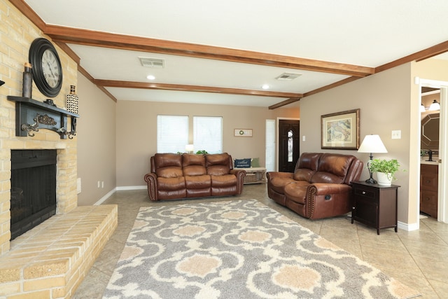 living room with baseboards, visible vents, a brick fireplace, and beamed ceiling