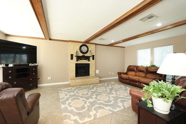 living area with light tile patterned floors, visible vents, baseboards, a fireplace, and beamed ceiling