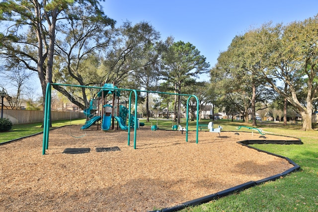 communal playground featuring a lawn