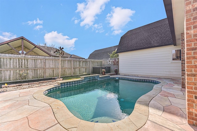 view of pool with a fenced in pool, a patio, and a fenced backyard