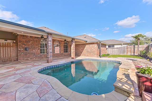 view of swimming pool with a patio, a ceiling fan, a fenced in pool, and a fenced backyard