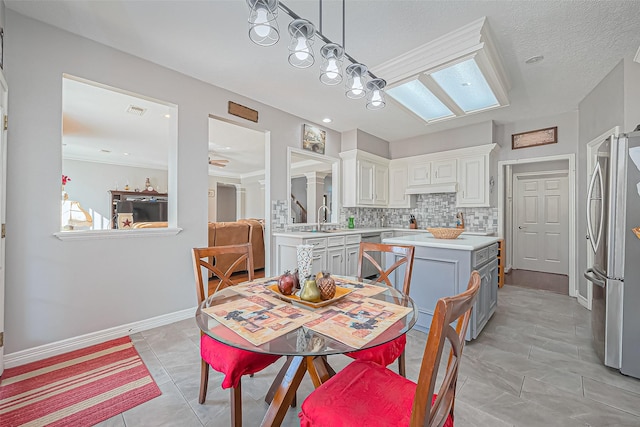 dining space featuring light tile patterned flooring, visible vents, and baseboards