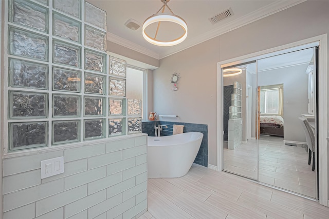 bathroom featuring a freestanding tub, visible vents, a walk in shower, connected bathroom, and crown molding