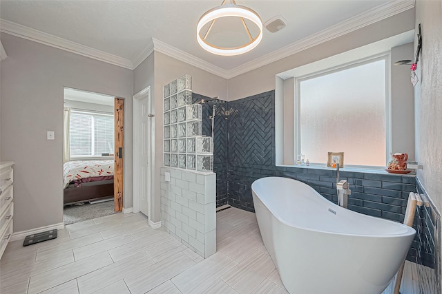 ensuite bathroom with ornamental molding, connected bathroom, tile walls, a soaking tub, and walk in shower