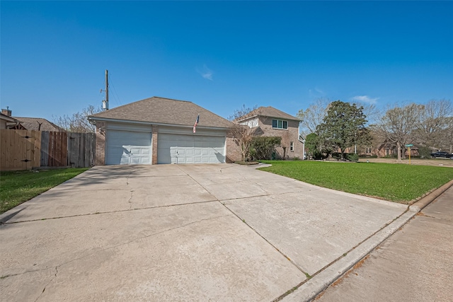 view of front of home featuring driveway, a front lawn, fence, an attached garage, and brick siding