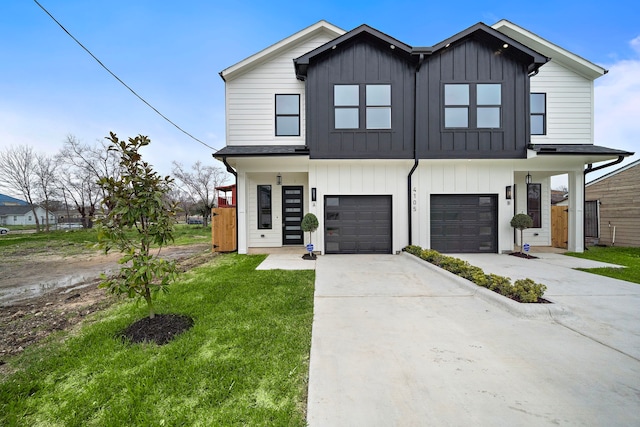 modern inspired farmhouse with a garage, board and batten siding, concrete driveway, and a front yard