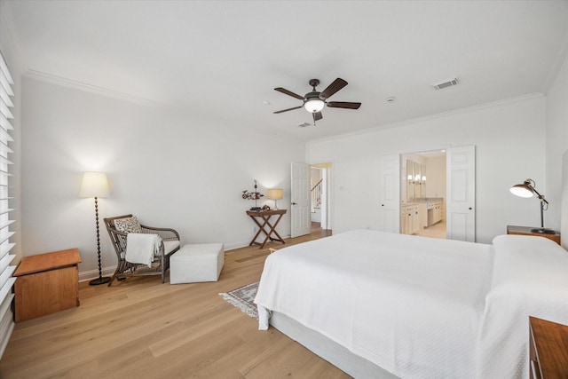 bedroom featuring visible vents, baseboards, crown molding, and light wood-style floors