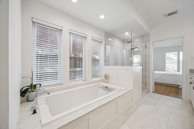 bathroom featuring visible vents, recessed lighting, ceiling fan, a shower stall, and a bath