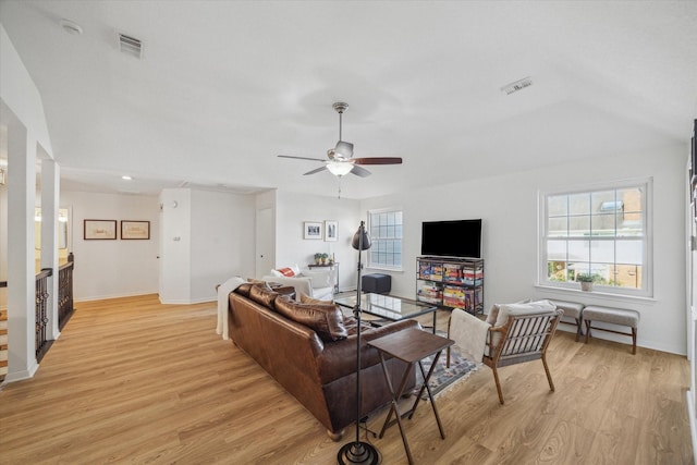 living room with visible vents, plenty of natural light, and light wood-style floors