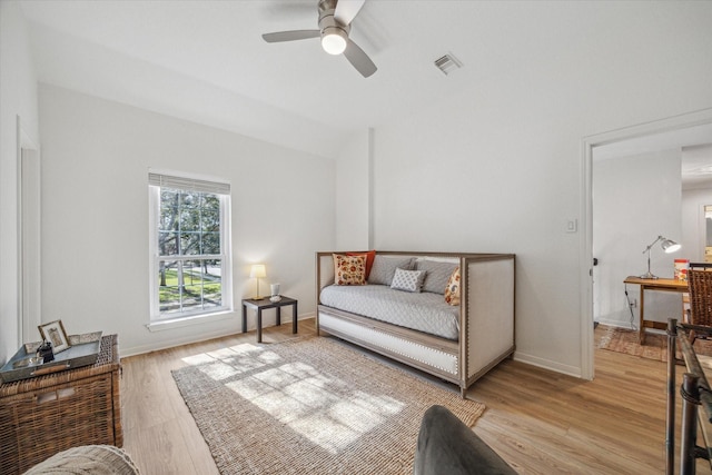 interior space with visible vents, baseboards, light wood-type flooring, and ceiling fan