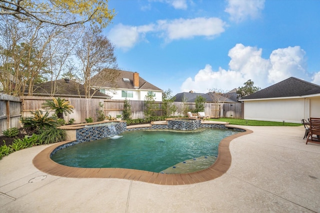 view of pool featuring an outdoor hot tub, a fenced in pool, a fenced backyard, and a patio area