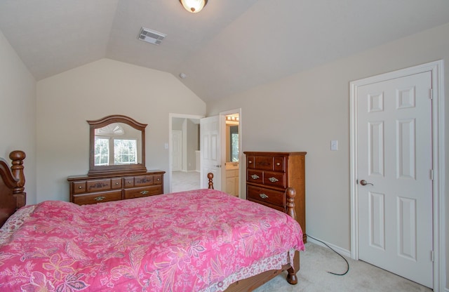 bedroom with visible vents, lofted ceiling, light colored carpet, and baseboards