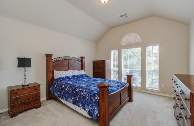 bedroom featuring visible vents, light colored carpet, baseboards, and vaulted ceiling