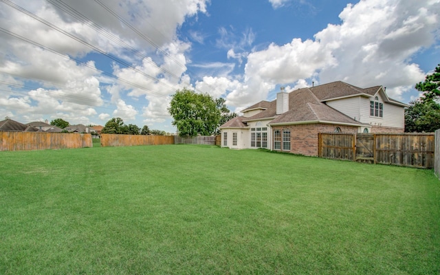 view of yard featuring a fenced backyard