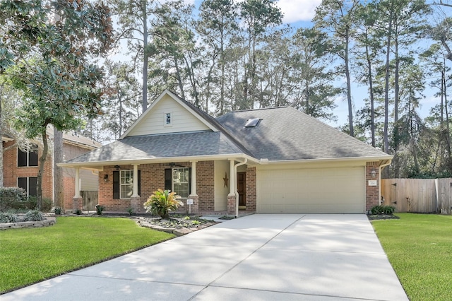 view of front of home featuring brick siding, a garage, a front yard, and roof with shingles