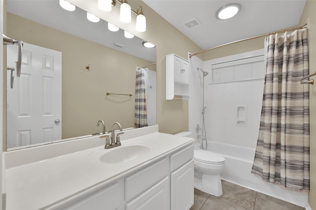 bathroom featuring vanity, visible vents, tile patterned flooring, shower / bath combo with shower curtain, and toilet