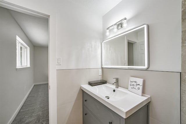 bathroom with vanity and baseboards