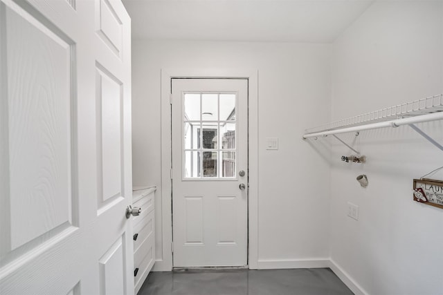 interior space featuring laundry area and baseboards