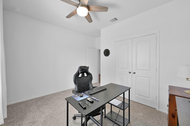 office with visible vents, baseboards, carpet, and ceiling fan