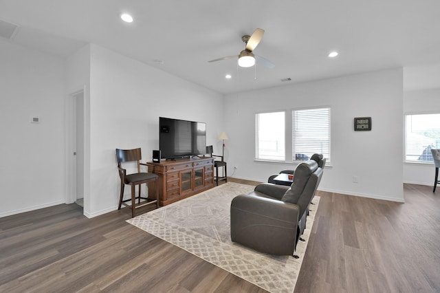 living area featuring wood finished floors, recessed lighting, a ceiling fan, and baseboards