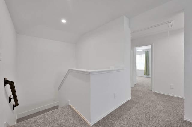 corridor featuring an upstairs landing, recessed lighting, carpet floors, lofted ceiling, and attic access