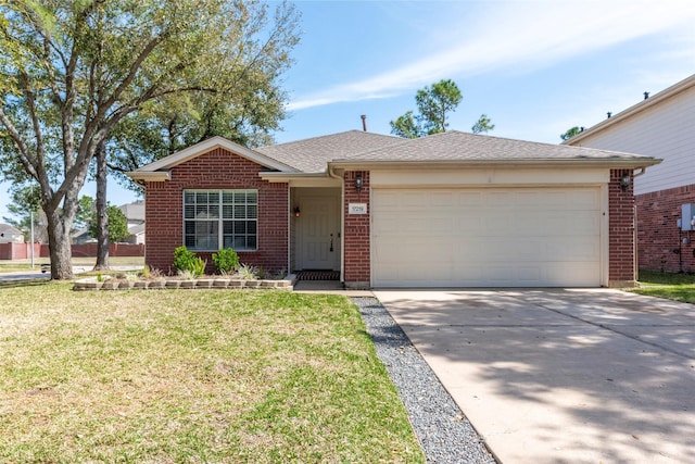 single story home with a front yard, roof with shingles, an attached garage, concrete driveway, and brick siding