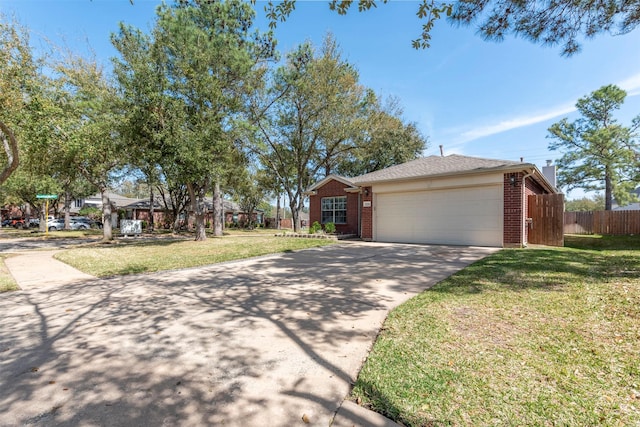 ranch-style home with fence, concrete driveway, a front lawn, a garage, and brick siding