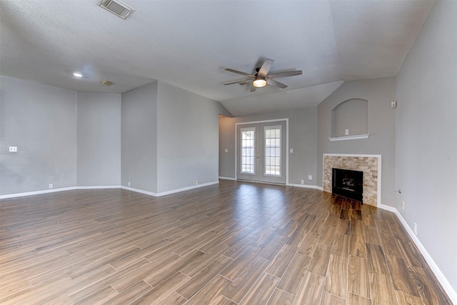 unfurnished living room with visible vents, baseboards, wood finished floors, and a ceiling fan