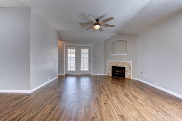 unfurnished living room featuring baseboards, wood finished floors, and ceiling fan