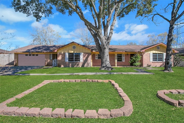 ranch-style home with brick siding, an attached garage, and a front lawn