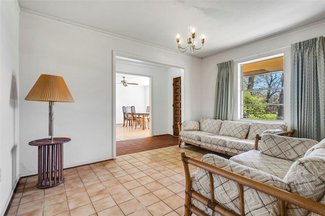 living room with light tile patterned floors, an inviting chandelier, and crown molding