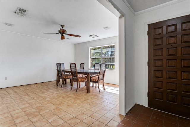 dining area with visible vents, ornamental molding, and a ceiling fan