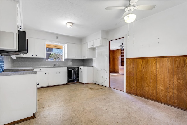 kitchen with dishwasher, light floors, white cabinetry, and a sink