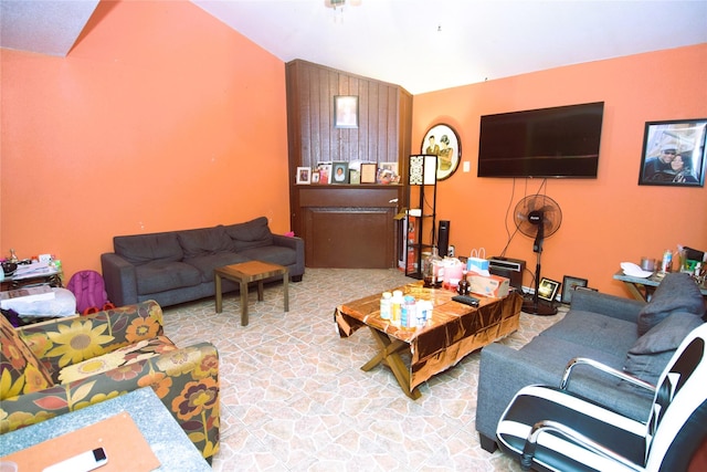 living room featuring lofted ceiling