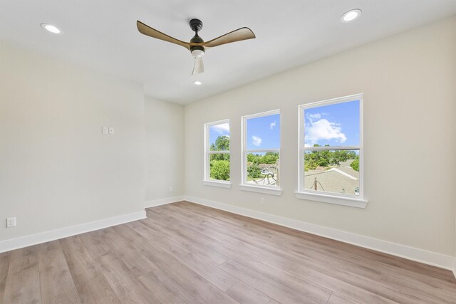 spare room with recessed lighting, baseboards, light wood-style flooring, and ceiling fan