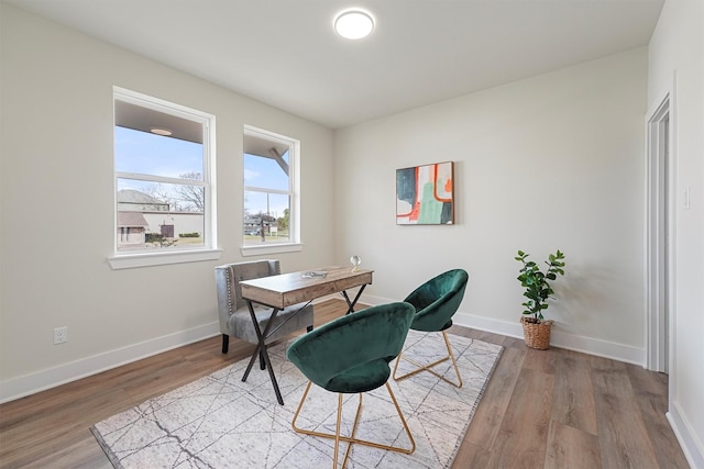 office with wood finished floors and baseboards